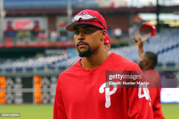 Jesen Therrien of the Philadelphia Phillies walks in from shagging fly balls in the outfield during batting practice before a game against the...