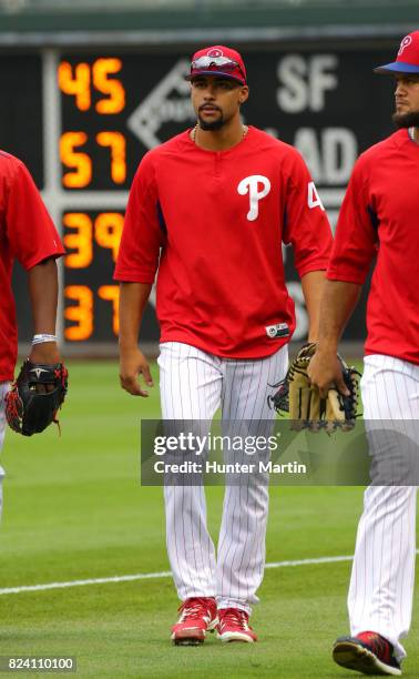 Jesen Therrien of the Philadelphia Phillies walks in from shagging fly balls in the outfield during batting practice before a game against the...