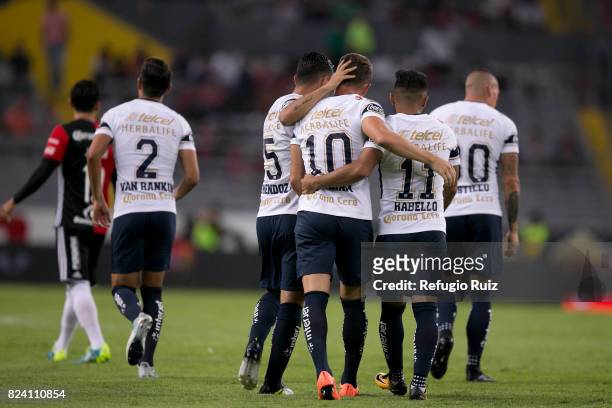 Abraham Gonzalez of Pumas celebrates with teammates after scoring the firts goal of his team during the 2nd round match between Atlas and Pumas UNAM...
