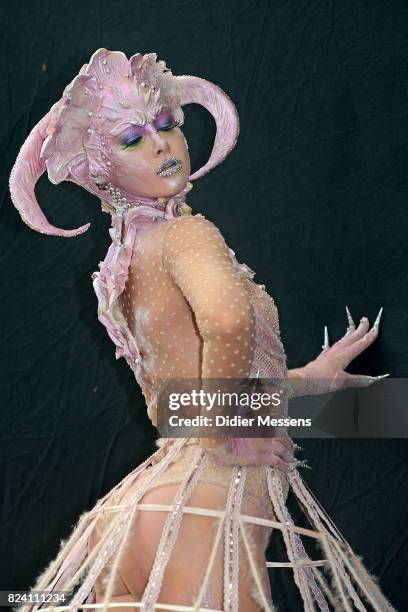 Model poses with her bodypainting designed by bodypainting artist Victoriia Bessarab from Ukraine during the World Bodypainting Festival 2017 on July...