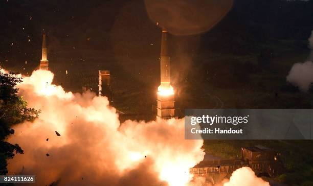 In this handout photo released by the South Korean Defense Ministry, South Korea's missile system firing Hyunmu-2 missiles into the East Sea during a...