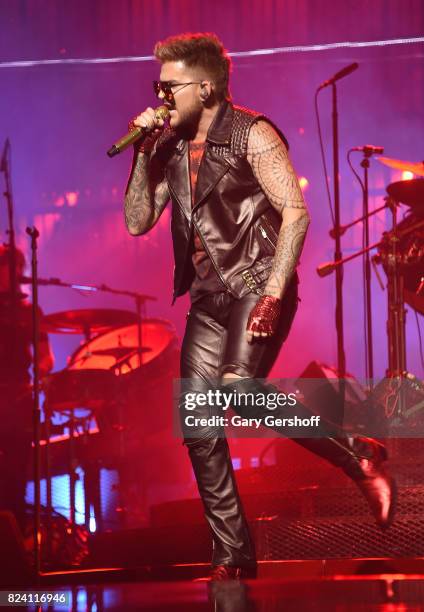 Singer Adam Lambert performs on stage with the rock band Queen at Barclays Center of Brooklyn on July 28, 2017 in the Brooklyn borough of New York...