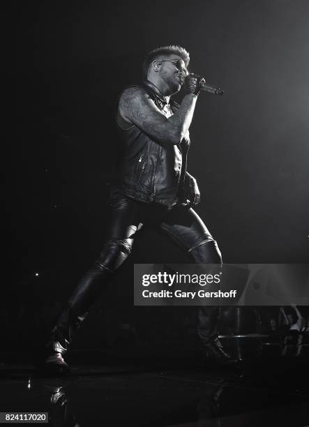 Singer Adam Lambert performs on stage with the rock band Queen at Barclays Center of Brooklyn on July 28, 2017 in the Brooklyn borough of New York...