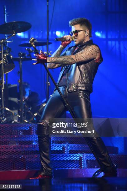 Singer Adam Lambert performs on stage with the rock band Queen at Barclays Center of Brooklyn on July 28, 2017 in the Brooklyn borough of New York...