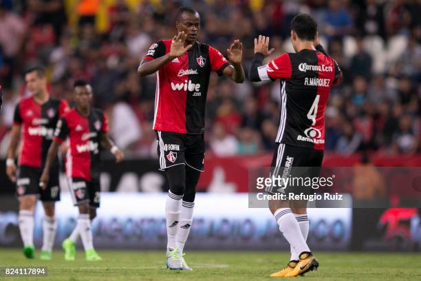 Jaine Barreiro of Atlas celebrates with teammate Rafael Márquez after scoring the first goal of his team during the 2nd round match between Atlas and...