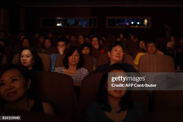 In this picture taken on July 28, 2017 Malaysians watch a Malaysian-Chinese Cantonese opera performance in Kuala Lumpur. Malaysia's National...