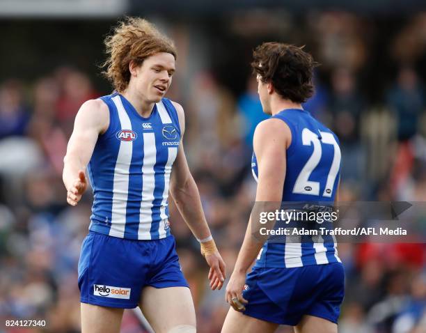Ben Brown of the Kangaroos celebrates a goal with Taylor Garner of the Kangaroos during the 2017 AFL round 19 match between the North Melbourne...