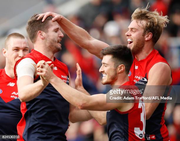 Jesse Hogan of the Demons celebrates a goal with teammates \Alex Neal-Bullen and Jack Watts during the 2017 AFL round 19 match between the North...