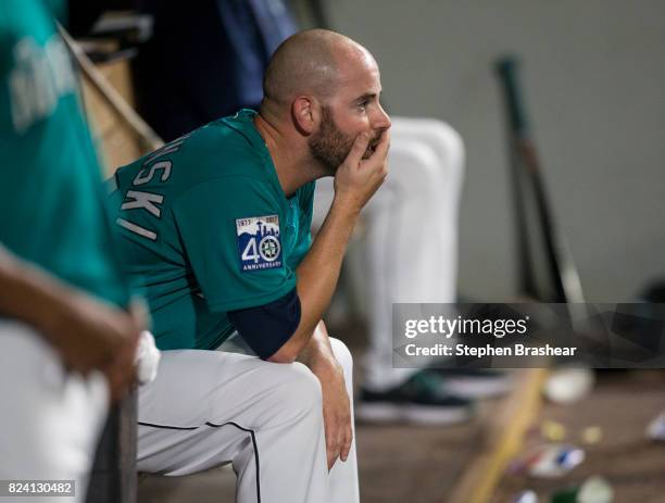 Relief pitcher Marc Rzepczynski of the Seattle Mariners sits in the dugout after being pulled from an interleague game after giving up a solo home...