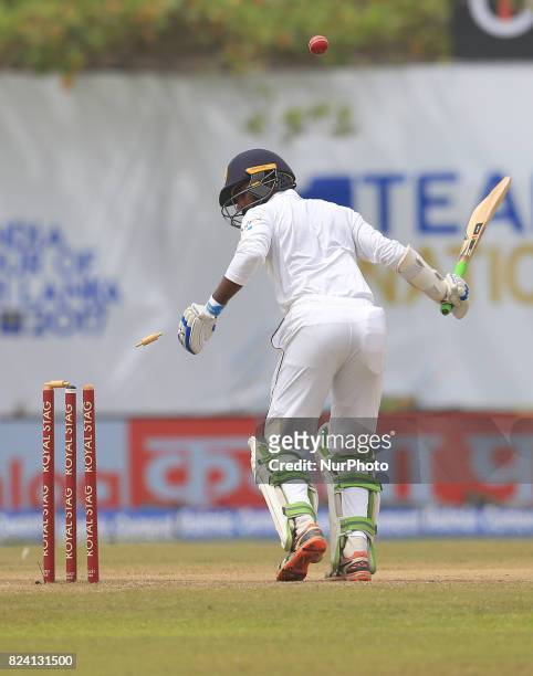 Sri Lankan cricketer Upul Tharanga is bowled out during the 4th Day's play in the 1st Test match between Sri Lanka and India at the Galle cricket...