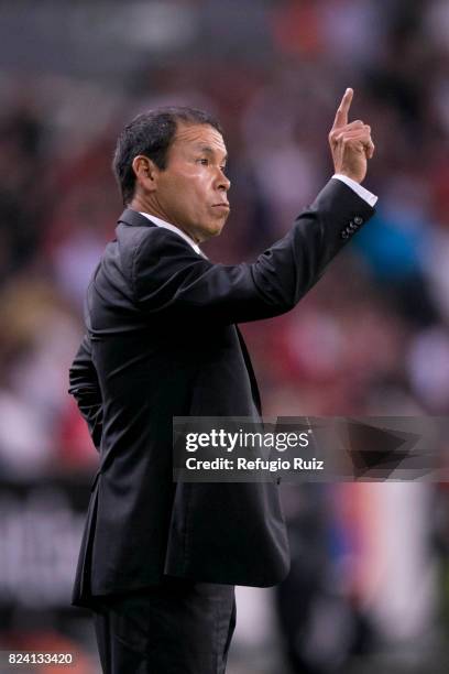 José Cruz coach of Atlas gives instructions to his players during the 2nd round match between Atlas and Pumas UNAM as part of the Torneo Apertura...