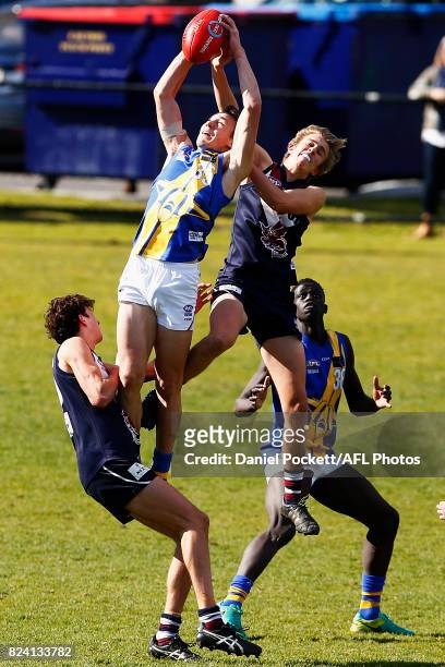 Blake Graham of the Jets and Josh Paul of the Dragons contest the ball during the round 14 TAC Cup match between Sandringham and the Western Jets at...