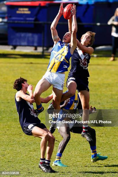 Blake Graham of the Jets and Josh Paul of the Dragons contest the ball during the round 14 TAC Cup match between Sandringham and the Western Jets at...