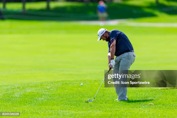Shane Lowry hits a shot out of the rough during second round action of the RBC Canadian Open on July 28 at Glen Abbey Golf Club in Oakville, ON,...