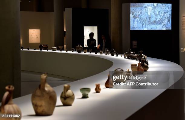 Georgian wine carafes dating from several different eras sit on display at an exhibition at The Cité du Vin in Bordeaux on July 28, 2017. Georgia,...