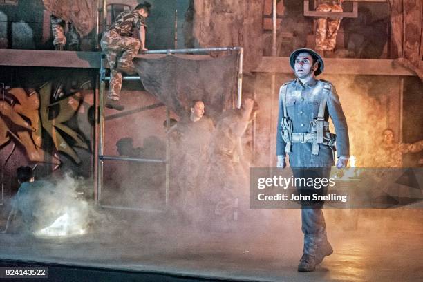 Bradley Travis as Siegfried Sassoon with the Company perform on stage during a performance of "Silver Birch" a new opera by Roxanna at Garsington...