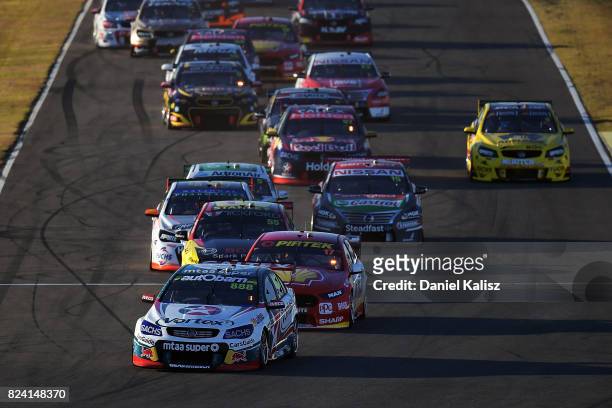 Craig Lowndes drives the TeamVortex Holden Commodore VF leads the field at the start of race 15 for the Ipswich SuperSprint, which is part of the...