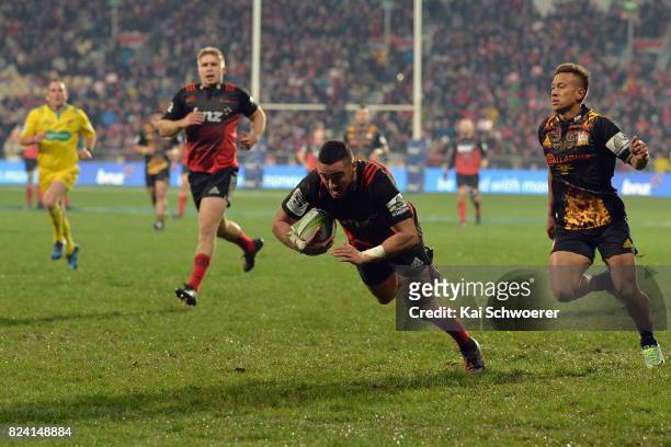 Bryn Hall of the Crusaders dives over to score a try during the Super Rugby Semi Final match between the Crusaders and the Chiefs at AMI Stadium on...