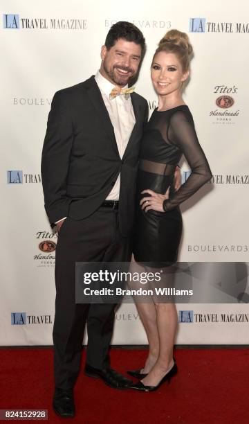 Actors John T. Woods and Katie McCabe attend the party for the unveiling of Los Angeles Travel Magazin's "Endless Summer" issue at Boulevard3 on July...