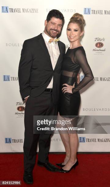 Actors John T. Woods and Katie McCabe attend the party for the unveiling of Los Angeles Travel Magazin's "Endless Summer" issue at Boulevard3 on July...