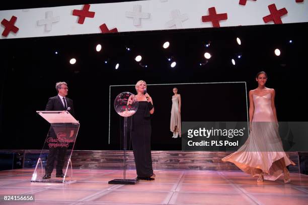 Francois Cluzet and Maitena Biraben speak on stage at the 69th Monaco Red Cross Ball Gala at Sporting Monte-Carlo on July 28, 2017 in Monte-Carlo,...