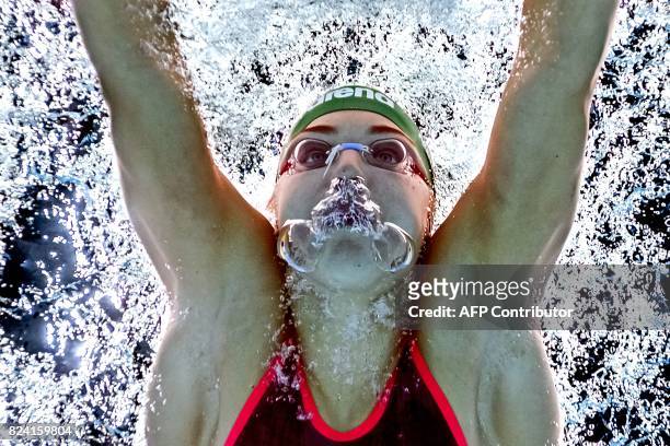 This picture taken with an underwater camera shows Lithuania's Ruta Meilutyte competing in a heat of the women's 50m breaststroke during the swimming...