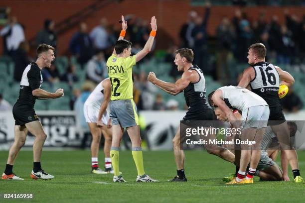 Robbie Gray of the Power and Brad Ebert celebrates the win after the final siren during the round 19 AFL match between the Port Adelaide Power and...