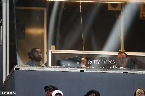 Sia Soliola and Ricky Stuart of the Raiders look on from the coaches box during the round 21 NRL match between the South Sydney Rabbitohs and the...