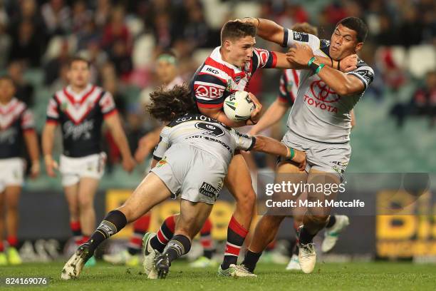 Victor Radley of the Roosters is tackled during the round 21 NRL match between the Sydney Roosters and the North Queensland Cowboys at Allianz...