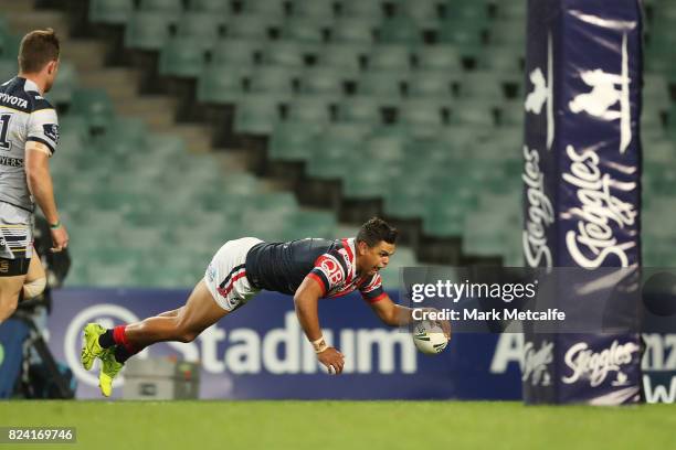 Latrell Mitchell of the Roosters scores a try during the round 21 NRL match between the Sydney Roosters and the North Queensland Cowboys at Allianz...