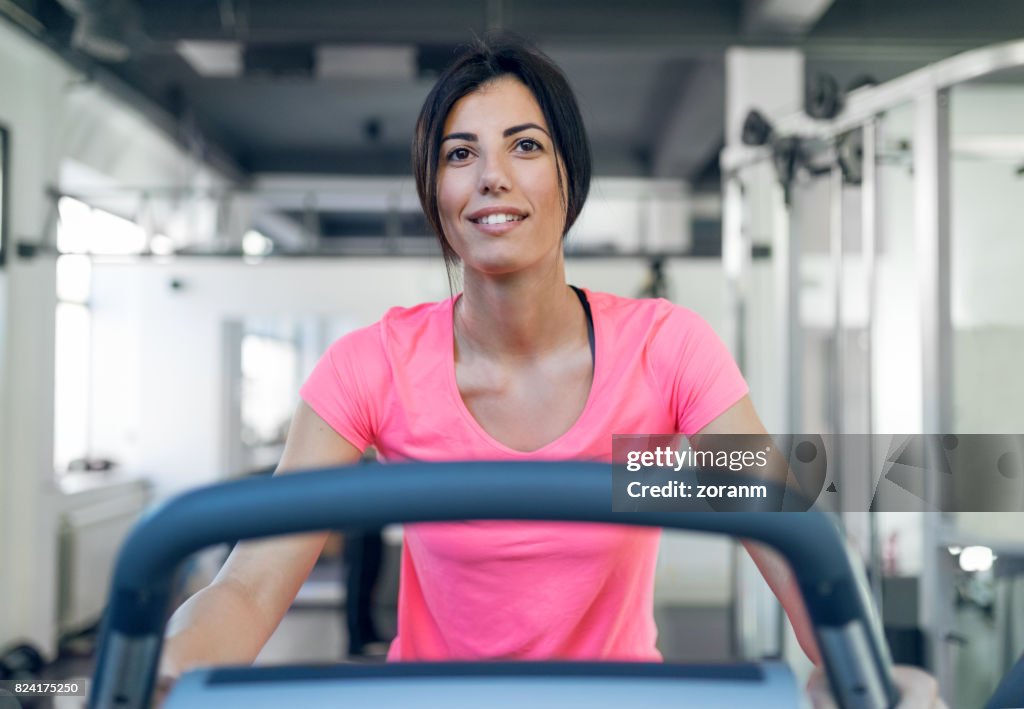 Woman exercising on spin machine