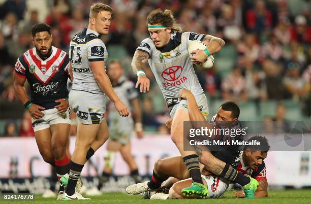 Ethan Lowe of the Cowboys is tackled during the round 21 NRL match between the Sydney Roosters and the North Queensland Cowboys at Allianz Stadium on...