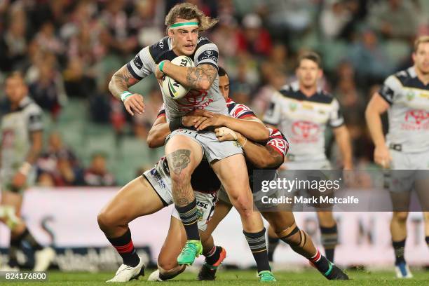 Ethan Lowe of the Cowboys is tackled during the round 21 NRL match between the Sydney Roosters and the North Queensland Cowboys at Allianz Stadium on...