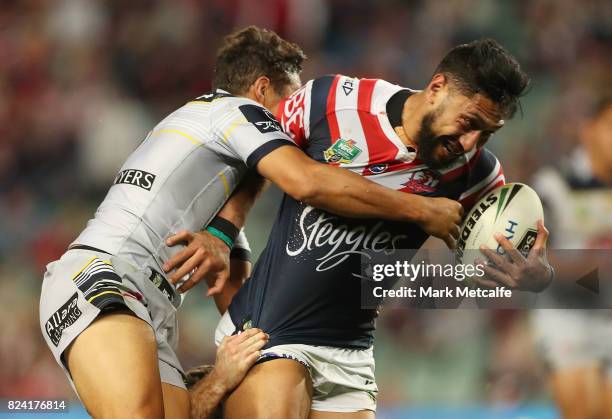 Isaac Liu of the Roosters is tackled during the round 21 NRL match between the Sydney Roosters and the North Queensland Cowboys at Allianz Stadium on...