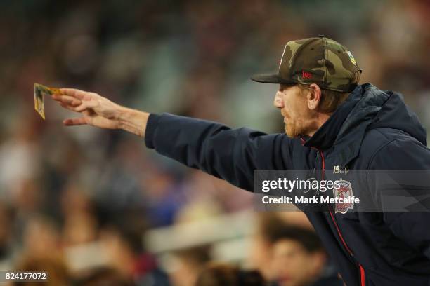 Roosters fan gestures to the referee uring the round 21 NRL match between the Sydney Roosters and the North Queensland Cowboys at Allianz Stadium on...