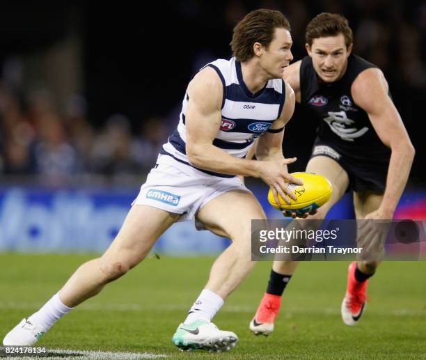 Patrick Dangerfield of the Cats runs with the ball during the round 19 AFL match between the Carlton Blues and the Geelong Cats at Etihad Stadium on...