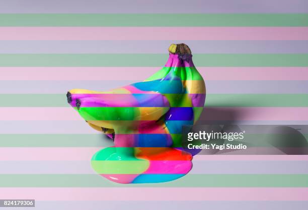 banana on color blocked background - creative food stock pictures, royalty-free photos & images