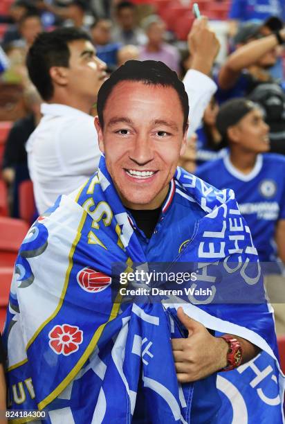 Fan wears a mask with the image of former Chelsea player John Terry during the International Champions Cup match between FC Internazionale and...