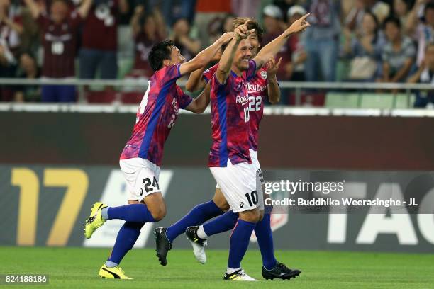 Lukas Podolski of Vissel Kobe celebrates scoring the opening goal with his team mates during the J.League J1 match between Vissel Kobe and Omiya...