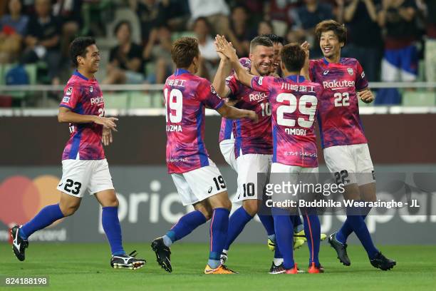 Lukas Podolski of Vissel Kobe celebrates scoring the opening goal with his team mates during the J.League J1 match between Vissel Kobe and Omiya...