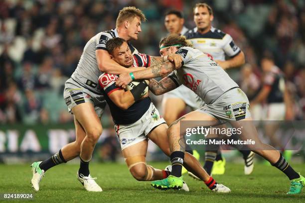 Jared Waerea-Hargreaves of the Roosters is tackled during the round 21 NRL match between the Sydney Roosters and the North Queensland Cowboys at...