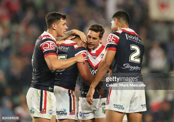 Sio Siua Taukeiaho of the Roosters celebrates scoring a try with team mates during the round 21 NRL match between the Sydney Roosters and the North...