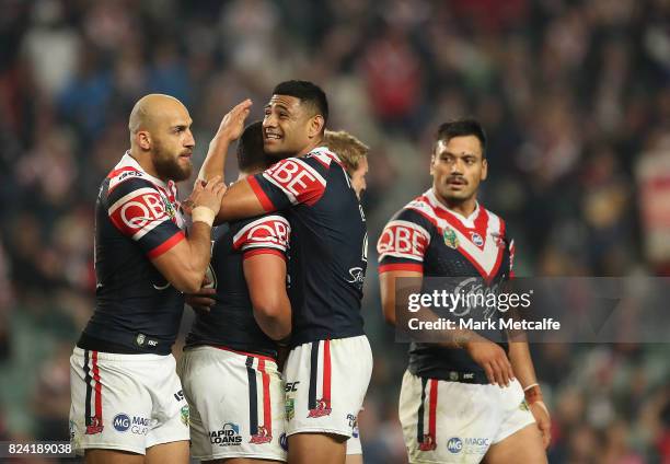 Sio Siua Taukeiaho of the Roosters celebrates scoring a try with team mates during the round 21 NRL match between the Sydney Roosters and the North...