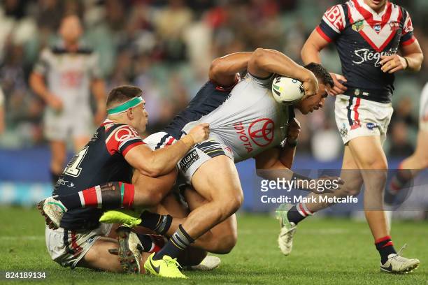 Jason Taumalolo of the Cowboys is tackled during the round 21 NRL match between the Sydney Roosters and the North Queensland Cowboys at Allianz...