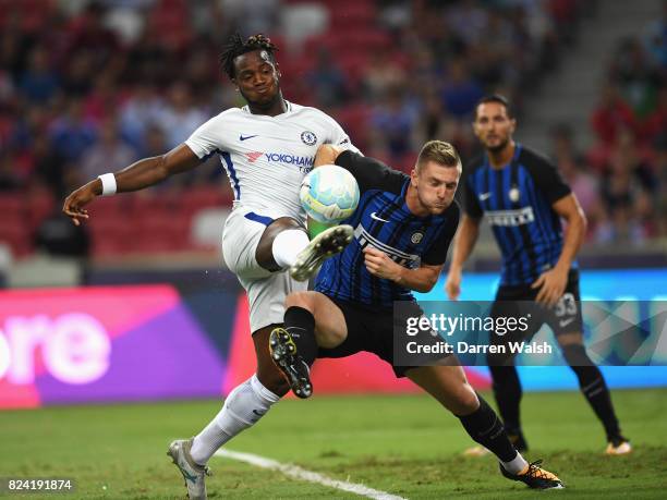 Michy Batshuayi of Chelsea is challenged by Milan Skriniar of Internazionale during the International Champions Cup match between FC Internazionale...