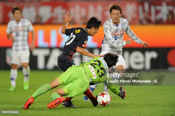 Hiroki Abe of Kashima Antlers scores his side's third goal past Hiroki Oka of Ventforet Kofu during the J.League J1 match between Kashima Antlers and...
