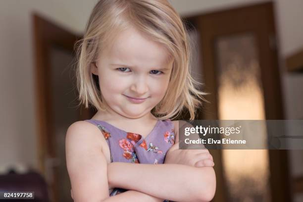 child (4-5) with arms folded and glaring, bossy facial expression - dominerande bildbanksfoton och bilder