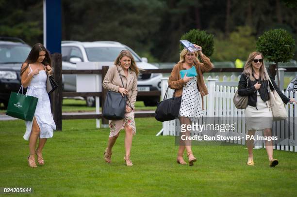 Spectators arrive at the Royal Salute Coronation Cup polo at Windsor Great Park in Surrey.