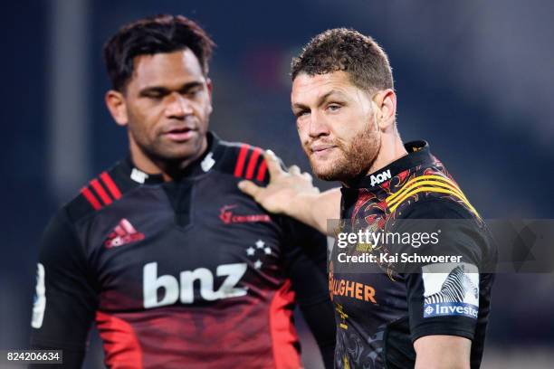 Tawera Kerr-Barlow of the Chiefs congratulates Seta Tamanivalu of the Crusaders following the Super Rugby Semi Final match between the Crusaders and...