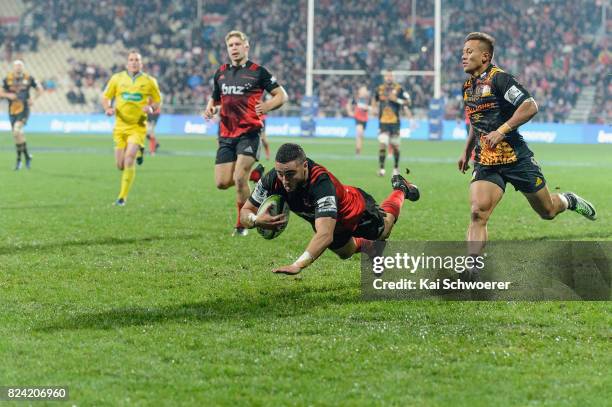 Bryn Hall of the Crusaders dives over to score a try during the Super Rugby Semi Final match between the Crusaders and the Chiefs at AMI Stadium on...